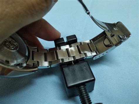 adjusting watch band links.